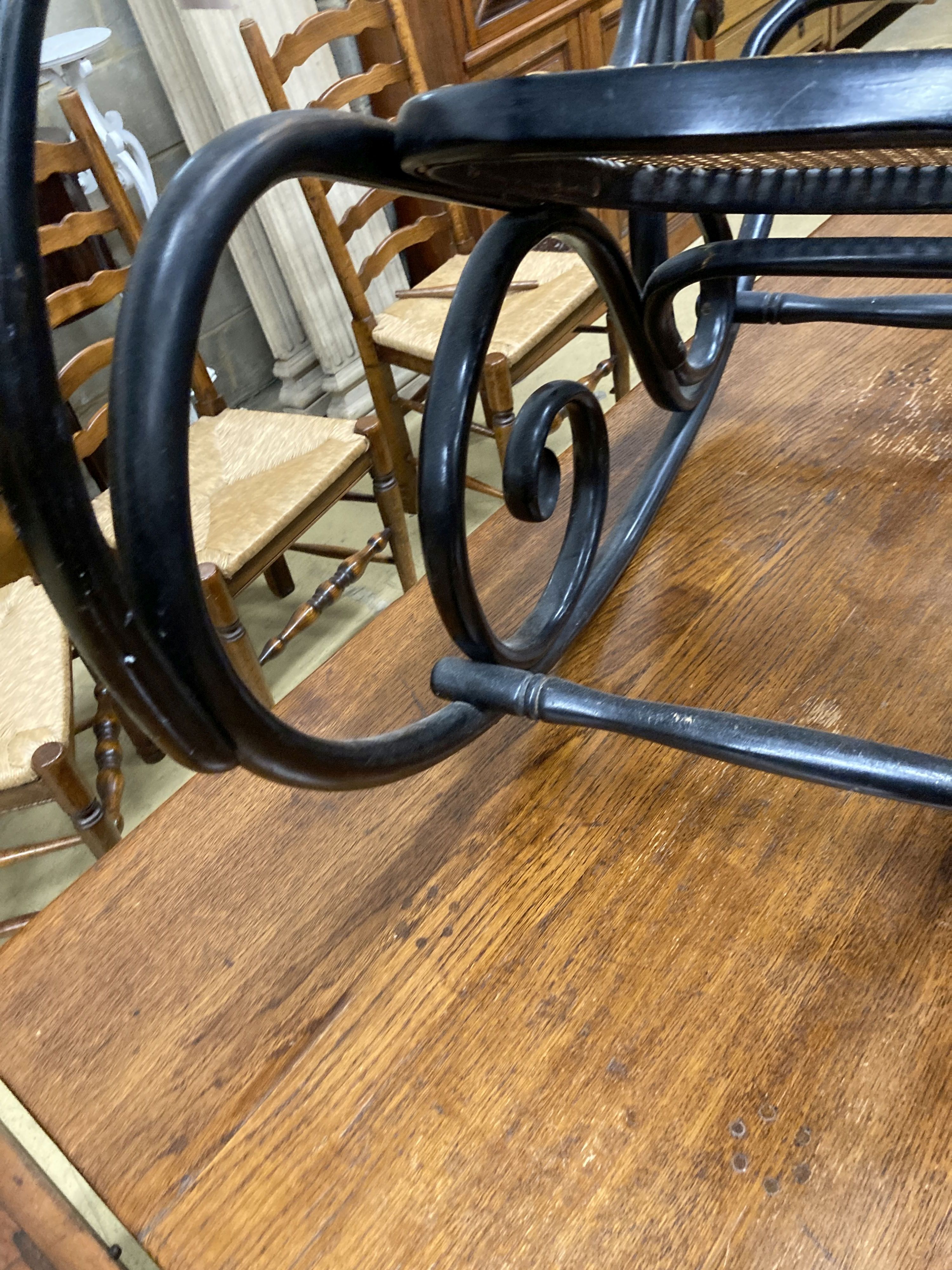 A Habitat 1970s ebonised bentwood caned rocking chair, width 50cm, depth 106cm, height 107cm